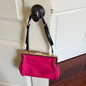 Kate spade beautiful pink bag with black strap used but in great condition.